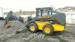 2002 New Holland LS180 Skid Steer. Bobcat with BackHoe Attachment